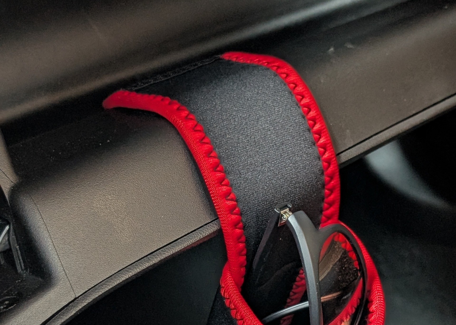 ShadeShark secure storage prevents sunglasses from falling when glove compartment opens